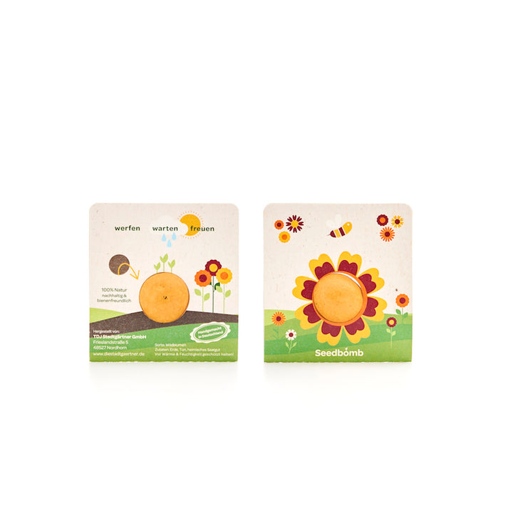 Zwei bunte Verpackungen mit Samenbomben, illustriert mit Blumen und einer Biene, werben für bienenfreundliches Saatgut.