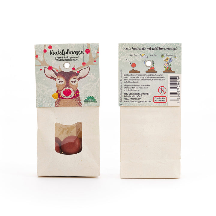 Zwei Tüten mit Wildblumensaat, eine mit gezeichnetem Rentier und Aufschrift "Rudolphnasen", die andere zeigt die Rückseite mit Beschreibung und Anleitung.