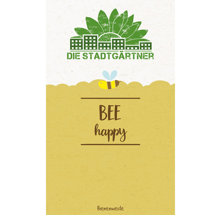 Illustration mit dem Text "DIE STADTGÄRTNER BEE happy" und dem Bild einer Biene über einer stilisierten Blumenwiese, im Hintergrund Häuser und Bäume.